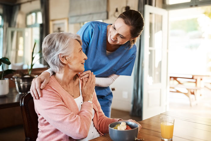 A carer with an elderly woman